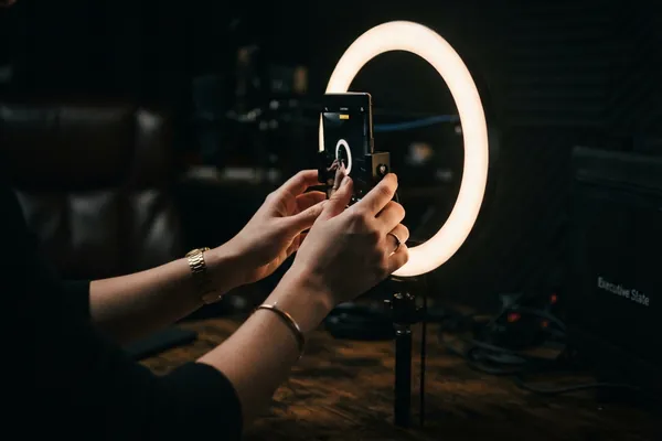 Creator filming branded content with a ring light for influencer marketing
